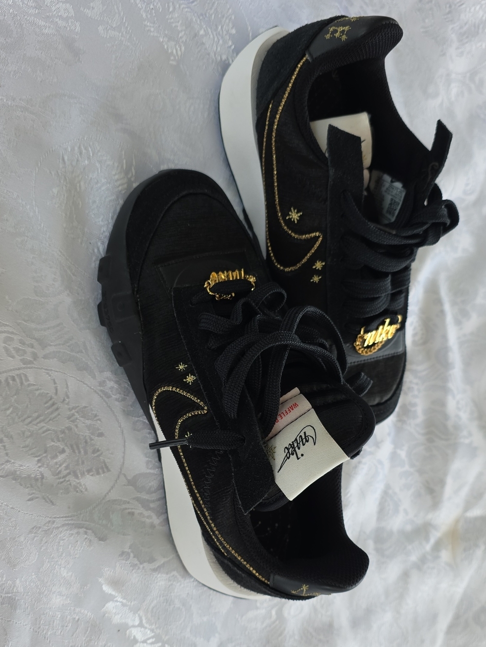 Nike Women's Black Sneakers with Gold Accents